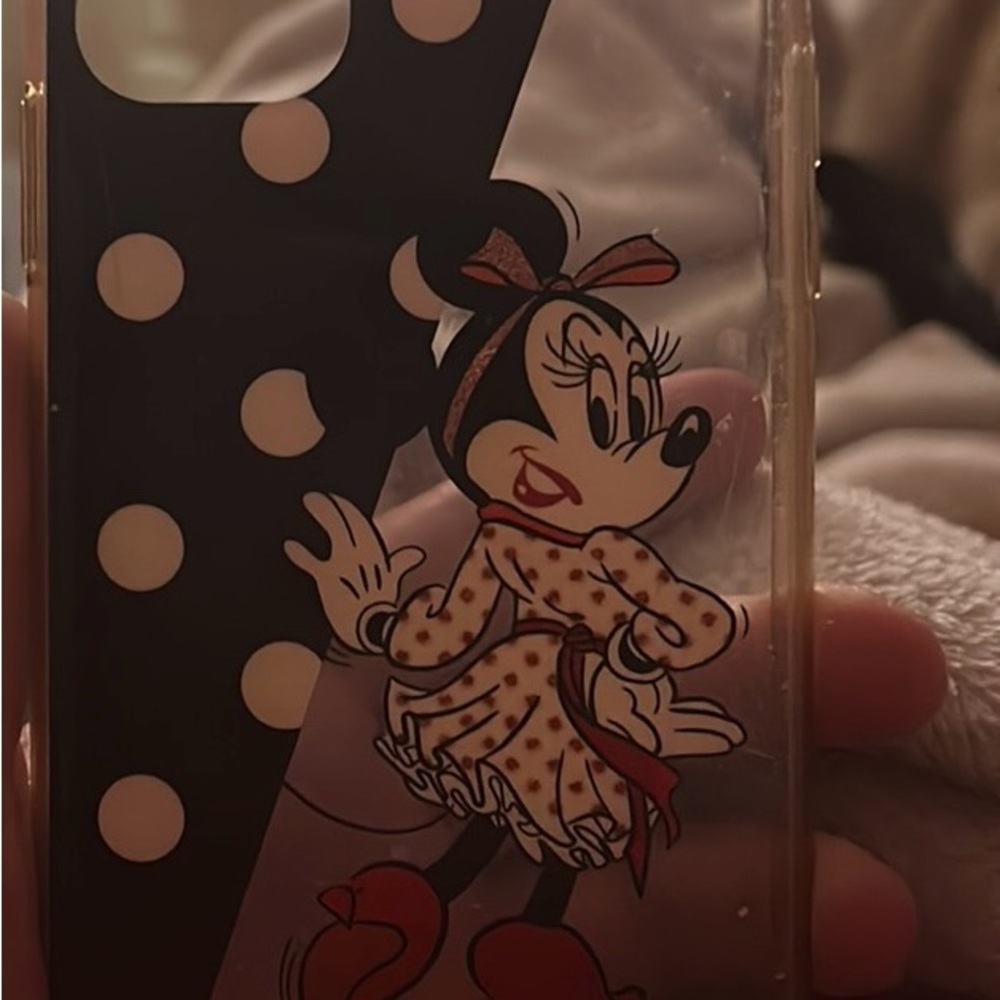 Kate Spade iPhone 11 case has some visible scratches from where in tear